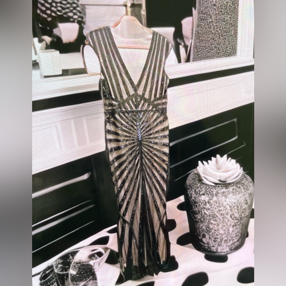 Black v-neck sequin maxi dress with an intricate design